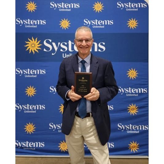Picture of John Manak at the Systems Unlimited annual awards ceremony on May 1, 2026