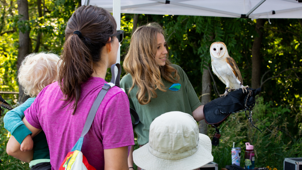 student at BioBlitz with an owl